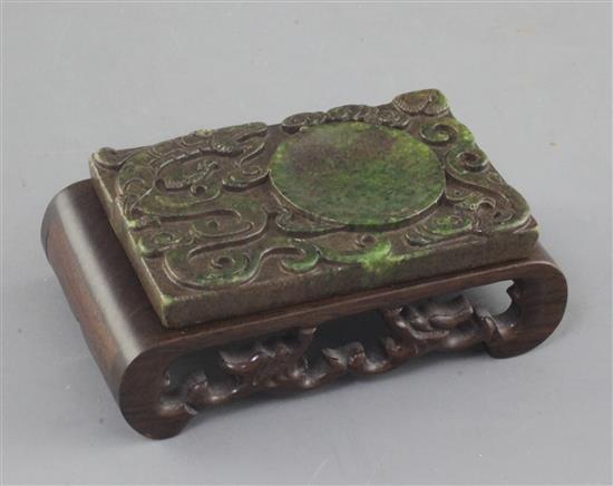 A Chinese green hardstone rectangular brushwasher, 9cm, carved wood stand